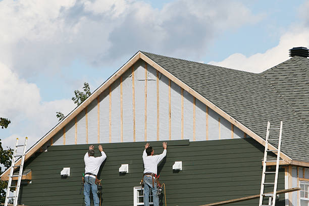 Professional Siding technician working in Groveland, MA